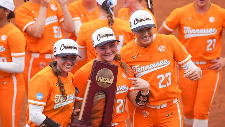 Tennessee outfielder Gabby Leach (55), Tennessee utility Ella Dodge (25) and Tennessee pitcher Karlyn Pickens (23) pose with the trophy after winning a NCAA super regional game between Tennessee and Georgia, advancing to the Women’s College World Series at Sherri Parker Lee Stadium in Knoxville, Tenn., on May 22, 2026. Tennessee outfielder Gabby Leach (55), Tennessee utility Ella Dodge (25) and Tennessee pitcher Karlyn Pickens (23) pose with the trophy after winning a NCAA super regional game between Tennessee and Georgia, advancing to the Women’s College World Series at Sherri Parker Lee Stadium in Knoxville, Tenn., on May 22, 2026.