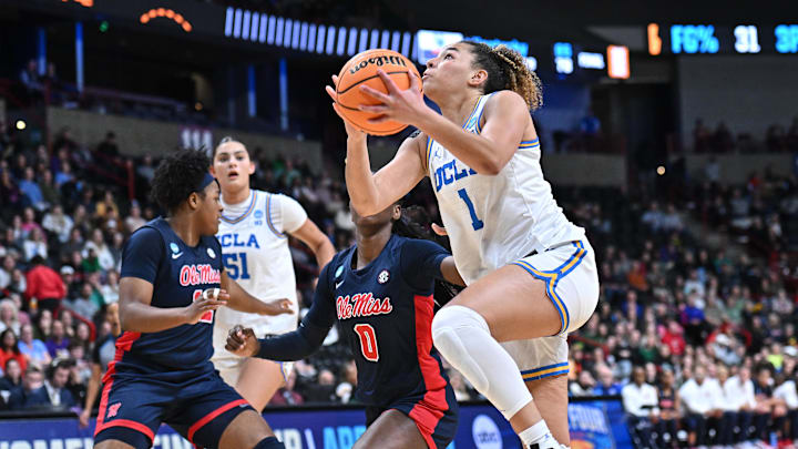 Mar 28, 2025; Spokane, WA, USA;UCLA Bruins guard Kiki Rice (1) shoots against Ole Miss Rebels guard Sira Thienou (0) during the second half of a Sweet 16 NCAA Tournament basketball game at Spokane Arena. at Spokane Arena. Mandatory Credit: James Snook-Imagn Images Mar 28, 2025; Spokane, WA, USA;UCLA Bruins guard Kiki Rice (1) shoots against Ole Miss Rebels guard Sira Thienou (0) during the second half of a Sweet 16 NCAA Tournament basketball game at Spokane Arena. at Spokane Arena. Mandatory Credit: James Snook-Imagn Images