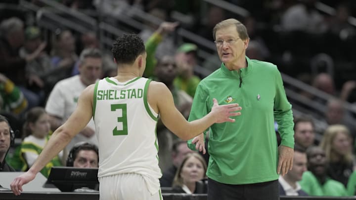 Mar 21, 2025; Seattle, WA, USA; Oregon Ducks head coach Dana Altman reacts with guard Jackson Shelstad (3) during the second half in the first round of the NCAA Tournament  at Climate Pledge Arena. Mandatory Credit: Stephen Brashear-Imagn Images