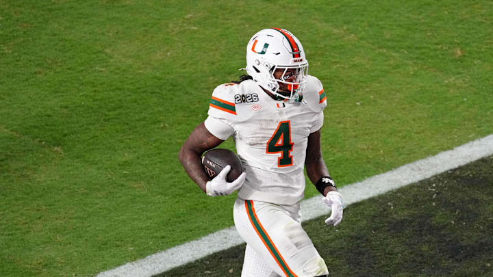 Jan 19, 2026; Miami Gardens, FL, USA; Miami Hurricanes running back Mark Fletcher Jr. (4) runs with the ball for a touchdown against the Indiana Hoosiers during the second half of the College Football Playoff National Championship game at Hard Rock Stadium. Mandatory Credit: James Lang-Imagn Images