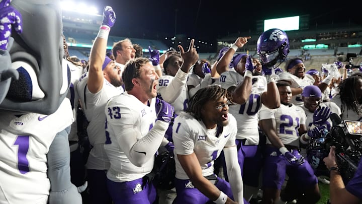 TCU Horned Frogs players celebrate after the game at Kenan Stadium.