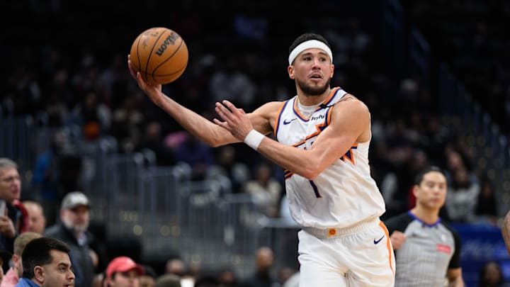 Jan 16, 2025; Washington, District of Columbia, USA; Phoenix Suns guard Devin Booker (1) grabs a loose ball during the fourth quarter against the Washington Wizards at Capital One Arena. Mandatory Credit: Reggie Hildred-Imagn Images