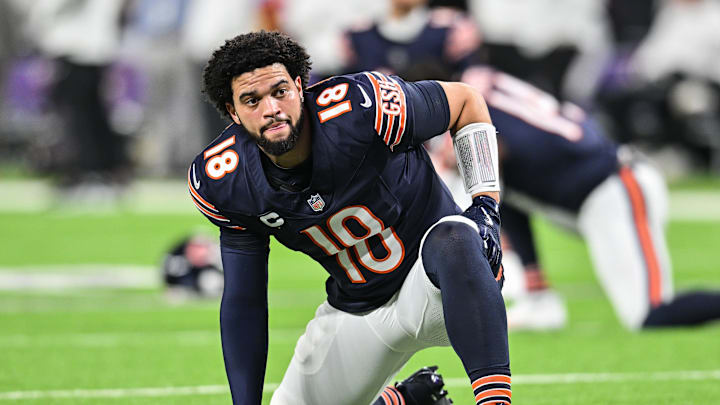 Dec 16, 2024; Minneapolis, Minnesota, USA; Chicago Bears quarterback Caleb Williams (18) looks on before the game against the Minnesota Vikings at U.S. Bank Stadium. Mandatory Credit: Jeffrey Becker-Imagn Images