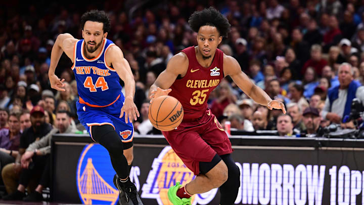 Cleveland Cavaliers forward Isaac Okoro brings the ball up court against New York Knicks guard Landry Shamet during the second half at Rocket Arena. Mandatory Credit: Ken Blaze-Imagn Images