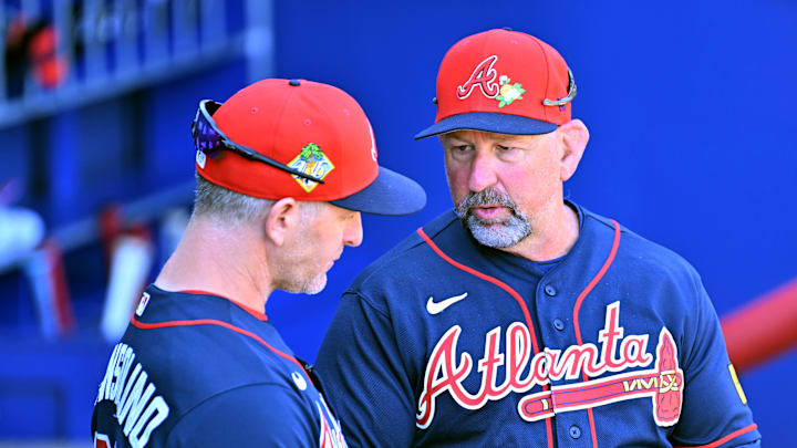 Feb 25, 2026; North Port, Florida, USA;  Atlanta Braves manager Walt Weiss (4) talks with bench coach Tony Mansolino (89) before the start of the game against the Pittsburgh Pirates during spring training at CoolToday Park. Mandatory Credit: Jonathan Dyer-Imagn Images