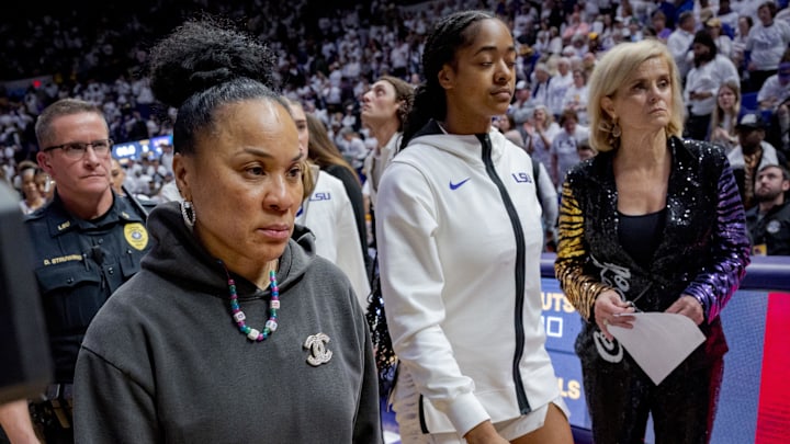 Jan 25, 2024; Baton Rouge, Louisiana, USA; South Carolina Gamecocks head coach Dawn Staley, left, walks past LSU Lady Tigers head coach Kim Mulkey after South Carolina   s victory at Pete Maravich Assembly Center. Mandatory Credit: Matthew Hinton-Imagn Images