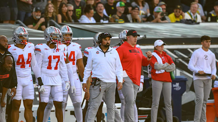 Oct 12, 2024; Eugene, Oregon, USA; Ohio State Buckeyes head coach Ryan Day (center) on the sidelines during the first quarter against the Oregon Ducks at Autzen Stadium. Mandatory Credit: Craig Strobeck-Imagn Images