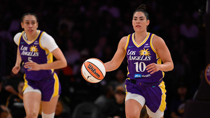 Aug 10, 2025; Los Angeles, California, USA; Los Angeles Sparks guard Kelsey Plum (10) dribbles the ball up court flanked by Los Angeles Sparks forward Dearica Hamby (5) during a WNBA game against the Seattle Storm at Crypto.com Arena. Mandatory Credit: Robert Hanashiro-Imagn Images