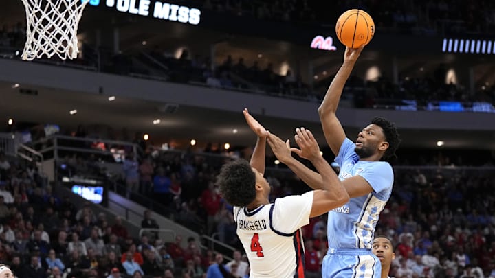 Mar 21, 2025; Milwaukee, WI, USA; North Carolina Tar Heels forward Jalen Washington (13) shoots against Mississippi Rebels forward Jaemyn Brakefield (4) during the second half of a first round NCAA men’s tournament game at Fiserv Forum. Mandatory Credit: Jeff Hanisch-Imagn Images