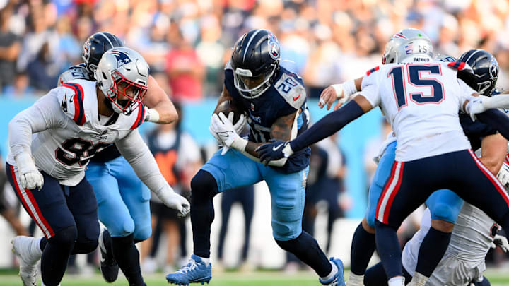 Nov 3, 2024; Nashville, Tennessee, USA;  Tennessee Titans running back Tony Pollard (20) runs the ball against the New England Patriots during the second half at Nissan Stadium. Mandatory Credit: Steve Roberts-Imagn Images