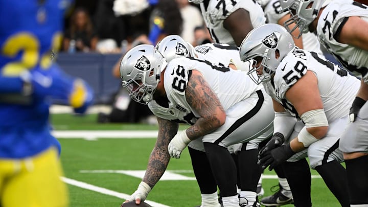 Oct 20, 2024; Inglewood, California, USA; Las Vegas Raiders center Andre James (68) and Las Vegas Raiders guard Jackson Powers-Johnson (58) driving the fourth quarter against the Los Angeles Rams at SoFi Stadium. Mandatory Credit: Robert Hanashiro-Imagn Images