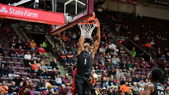 Feb 5, 2025; Blacksburg, Virginia, USA;  Virginia Tech Hokies forward Tobi Lawal (1) goes up for a dunk against Southern Methodist Mustangs during the second half at Cassell Coliseum. Mandatory Credit: Brian Bishop-Imagn Images