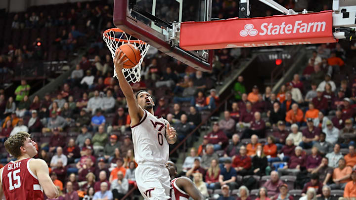 Jan 7, 2026; Blacksburg, Virginia, USA;  Virginia Tech Hokies guard Jailen Bedford (0) lays the ball up as Stanford Cardinal forward Oskar Giltay (15) looks on during the first half at Cassell Coliseum. Mandatory Credit: Brian Bishop-Imagn Images