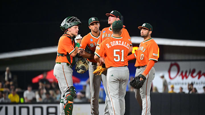Miami Hurricanes pitcher Reese Lumpkin (22)talks with teammates during a timeout against the Southern Miss Golden Eagles during the final game of the 2025 NCAA Hattiesburg Regional game at Pete Taylor Park in Hattiesburg, Mississippi, on June 2, 2025.