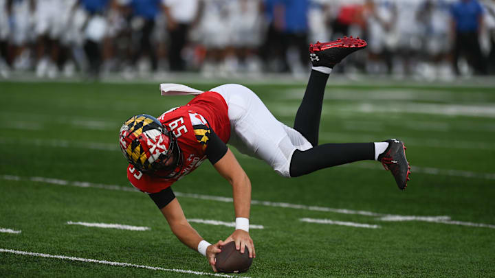 Sep 3, 2022; College Park, Maryland, USA;  Maryland Terrapins long snapper Ethan Gough (59) downs a punt on the one yard line during the second half against the Buffalo Bulls at Capital One Field at Maryland Stadium. Mandatory Credit: Tommy Gilligan-Imagn Images