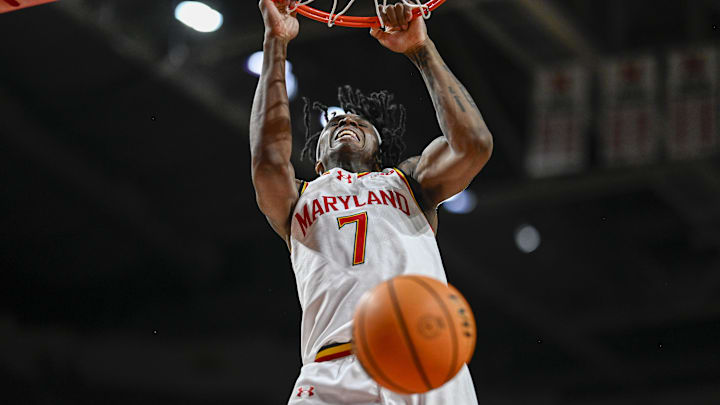 Feb 21, 2026; College Park, Maryland, USA;  Maryland Terrapins guard Andre Mills (7) dunks during the second  half against the Washington Huskies at Xfinity Center. Mandatory Credit: Tommy Gilligan-Imagn Images