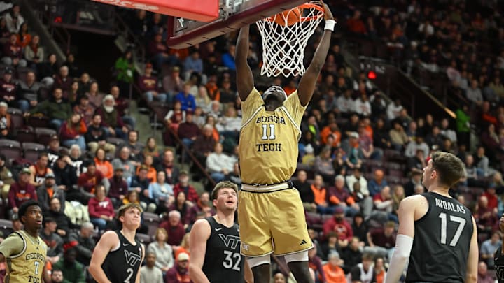 Jan 27, 2026; Blacksburg, Virginia, USA; Georgia Tech Yellow Jackets forward Baye Ndongo (11) dunks the ball as Virginia Tech Hokies guard Neoklis Avdalas (17) ad Virginia Tech Hokies center Christian Gurdak (32) watch during the first half at Cassell Coliseum. Mandatory Credit: Brian Bishop-Imagn Images Jan 27, 2026; Blacksburg, Virginia, USA; Georgia Tech Yellow Jackets forward Baye Ndongo (11) dunks the ball as Virginia Tech Hokies guard Neoklis Avdalas (17) ad Virginia Tech Hokies center Christian Gurdak (32) watch during the first half at Cassell Coliseum. Mandatory Credit: Brian Bishop-Imagn Images