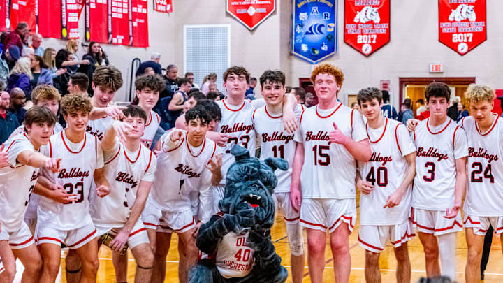 The Bulldogs are all smiles after their 65-59 victory over Foxboro in the first round of the MIAA State Playoffs.