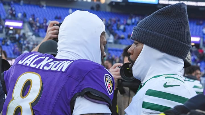 Nov 23, 2025; Baltimore, Maryland, USA; Baltimore Ravens quarterback Lamar Jackson (8) speaks with New York Jets quarterback Tyrod Taylor (2) after the game at M&T Bank Stadium. Mandatory Credit: Mitch Stringer-Imagn Images
