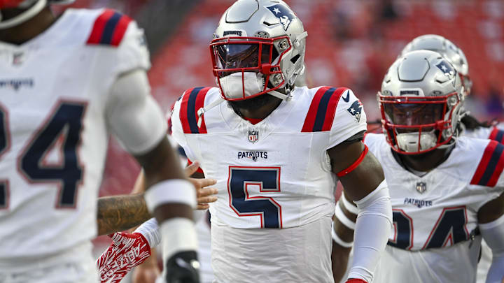 Aug 25, 2024; Landover, Maryland, USA;  New England Patriots safety Jabrill Peppers (5) takes the field with teammates before the game against the Washington Commanders at Commanders Field.