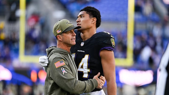 Oct 26, 2025; Baltimore, Maryland, USA; Baltimore Ravens head coach John Harbaugh greets Baltimore Ravens safety Kyle Hamilton (14) on the field after the game against the Chicago Bears at M&T Bank Stadium. Mandatory Credit: Tommy Gilligan-Imagn Images