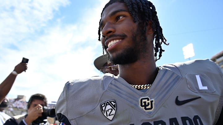 Buffaloes quarterback Shedeur Sanders (2) smiles as he walks off the field after the game against the USC Trojans at Folsom Field.