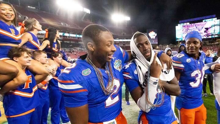 Florida Gators quarterback DJ Lagway (2) celebrates with Florida Gators running back KD Daniels (21) at Raymond James Stadium in Tampa, FL on Friday, December 20, 2024 in the 2024 Union Home Mortgage Gasparilla Bowl. The Gators defeated Tulane 33-8. [Doug Engle/Gainesville Sun]