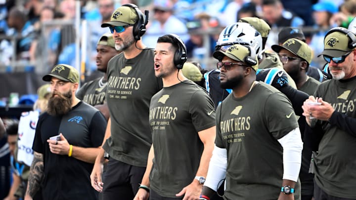 Nov 9, 2025; Charlotte, North Carolina, USA; Carolina Panthers head coach Dave Canales and coaching staff on the sidelines in the third quarter at Bank of America Stadium. Mandatory Credit: Bob Donnan-Imagn Images