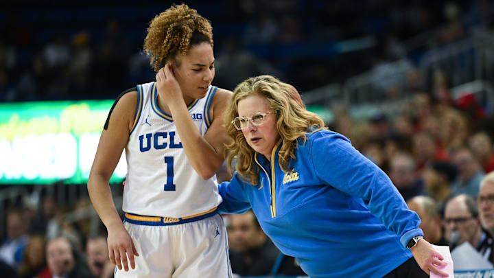 Dec 29, 2024; Los Angeles, California, USA; UCLA Bruins head coach Cori Close talks to UCLA Bruins guard Kiki Rice (1) during the third quarter against the Nebraska Cornhuskers at Pauley Pavilion presented by Wescom. Mandatory Credit: Robert Hanashiro-Imagn Images