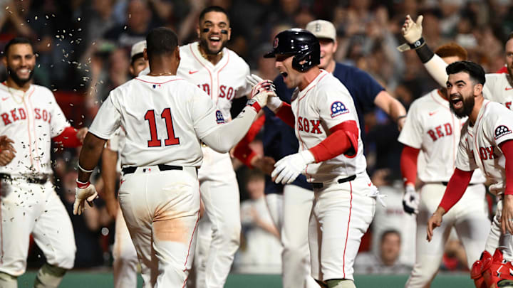 May 17, 2025; Boston, Massachusetts, USA; Boston Red Sox designated hitter Rafael Devers (11) celebrates with third baseman Alex Bregman (2) after hitting a walk off home run against the Atlanta Braves during the ninth inning at Fenway Park. Mandatory Credit: Brian Fluharty-Imagn Images