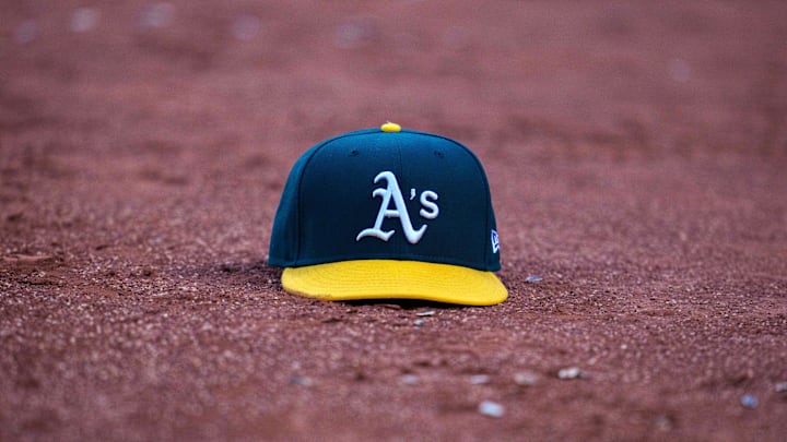 May 26, 2022; Oakland, California, USA; Oakland Athletics baseball hat on the field of play during the third inning after the called third strike of Oakland Athletics designated hitter Jed Lowrie (not pictured) at RingCentral Coliseum. Mandatory Credit: Neville E. Guard-Imagn Images May 26, 2022; Oakland, California, USA; Oakland Athletics baseball hat on the field of play during the third inning after the called third strike of Oakland Athletics designated hitter Jed Lowrie (not pictured) at RingCentral Coliseum. Mandatory Credit: Neville E. Guard-Imagn Images
