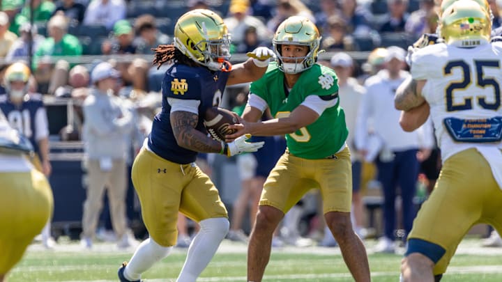 Apr 12, 2025; Notre Dame, IN, USA; Notre Dame Fighting Irish quarterback Kenny Minchey (8) hands off to running back Gi'Bran Payne (3) during the Blue-Gold game at Notre Dame Stadium. Mandatory Credit: Michael Caterina-Imagn Images Apr 12, 2025; Notre Dame, IN, USA; Notre Dame Fighting Irish quarterback Kenny Minchey (8) hands off to running back Gi'Bran Payne (3) during the Blue-Gold game at Notre Dame Stadium. Mandatory Credit: Michael Caterina-Imagn Images