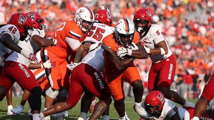 Aug 29, 2026; Charlottesville, Virginia, USA;  Virginia Cavaliers running back Xay Davis (25) rushes for touchdown during the fourth quarter of the game against the North Carolina State Wolfpack at Scott Stadium.  Mandatory Credit: Greg Atkins-Imagn Images