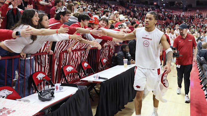 Feb 21, 2026; Fayetteville, Arkansas, USA; Arkansas Razorbacks guard Darius Acuff Jr. celebrates with fans after the game against the Missouri Tigers at Bud Walton Arena. Arkansas won 94-86. Mandatory Credit: Nelson Chenault-Imagn Images