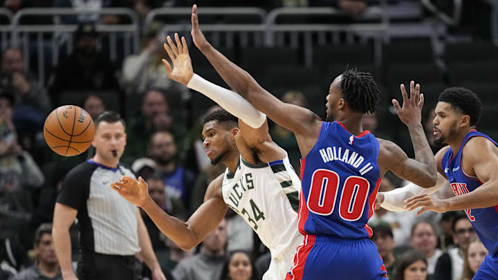 Nov 13, 2024; Milwaukee, Wisconsin, USA;  Detroit Pistons forward Ron Holland II (00) knocks the ball away from Milwaukee Bucks forward Giannis Antetokounmpo (34) during the third quarter at Fiserv Forum. Mandatory Credit: Jeff Hanisch-Imagn Images