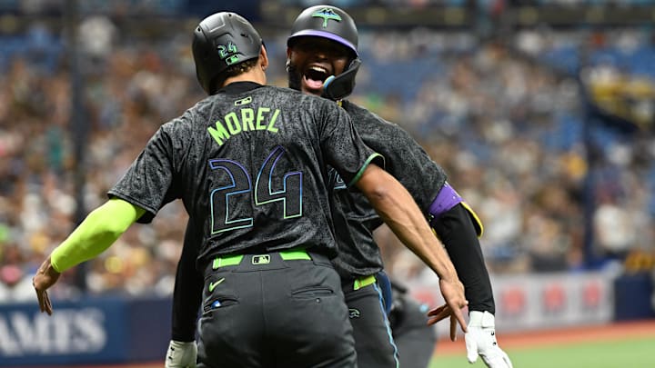 Aug 31, 2024; St. Petersburg, Florida, USA; Tampa Bay Rays third baseman Junior Caminero (13) celebrates with second baseman Christopher Morel (24) after hitting a three run home run in the second inning against the San Diego Padres at Tropicana Field. Mandatory Credit: Jonathan Dyer-Imagn Images