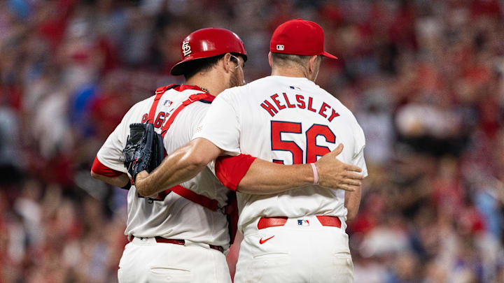 Jun 26, 2024; St. Louis, Missouri, USA; St. Louis Cardinals pitcher Ryan Helsley (56) and Willson Contreras (40) celebrate with a Cardinals 4-1 victory against the Atlanta Braves at Busch Stadium. Mandatory Credit: Zach Dalin-Imagn Images