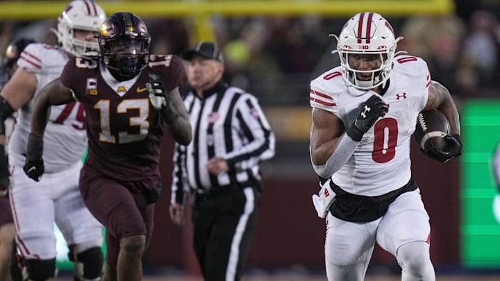 Nov 25, 2023; Minneapolis, Minnesota, USA; Wisconsin Badgers running back Braelon Allen (0) runs
