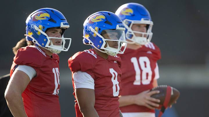 Kansas redshirt junior quarterback Cole Ballard (15) and Isaiah Marshall (8) watch during spring football practice Thursday, Mar. 26, 2026 in Lawrence, Kansas. Kansas redshirt junior quarterback Cole Ballard (15) and Isaiah Marshall (8) watch during spring football practice Thursday, Mar. 26, 2026 in Lawrence, Kansas.