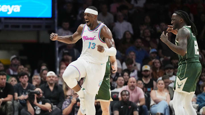 Apr 5, 2025; Miami, Florida, USA;  Miami Heat center Bam Adebayo (13) celebrates a shot made over Milwaukee Bucks forward Taurean Prince (12) during the second half at Kaseya Center. Mandatory Credit: Jim Rassol-Imagn Images