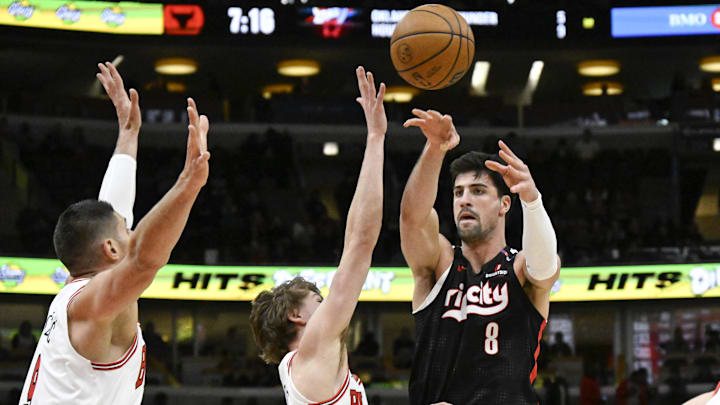 Apr 4, 2025; Chicago, Illinois, USA; Portland Trail Blazers forward Deni Avdija (8) passes the ball against Chicago Bulls forward Matas Buzelis (14) and center Nikola Vucevic (9) during the first half at United Center. Mandatory Credit: Matt Marton-Imagn Images Apr 4, 2025; Chicago, Illinois, USA; Portland Trail Blazers forward Deni Avdija (8) passes the ball against Chicago Bulls forward Matas Buzelis (14) and center Nikola Vucevic (9) during the first half at United Center. Mandatory Credit: Matt Marton-Imagn Images