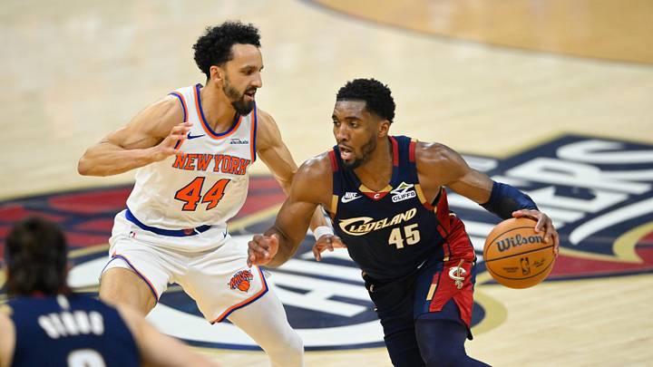 May 25, 2026; Cleveland, Ohio, USA; Cleveland Cavaliers guard Donovan Mitchell (45) drives the ball past New York Knicks guard Landry Shamet (44) in the second quarter during game four of the eastern conference finals for the 2026 NBA playoffs at Rocket Arena. Mandatory Credit: David Richard-Imagn Images