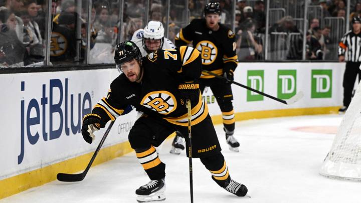 Apr 11, 2026; Boston, Massachusetts, USA; Boston Bruins left wing Viktor Arvidsson (71) skates for the puck against the Tampa Bay Lightning during the first period at the TD Garden. Mandatory Credit: Brian Fluharty-Imagn Images