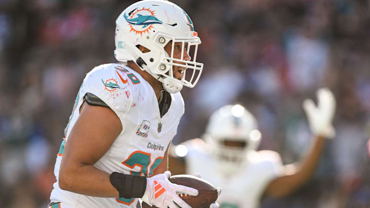 Miami Dolphins fullback Alec Ingold (30) scores a touchdown against the New England Patriots during the second half at Gillette Stadium. Miami Dolphins fullback Alec Ingold (30) scores a touchdown against the New England Patriots during the second half at Gillette Stadium.