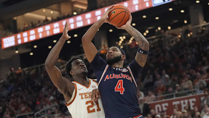 Jan 7, 2025; Austin, Texas, USA; Auburn Tigers forward Johni Broome (4) drives to the basket against Texas Longhorns forward Ze'Rik Onyema (21) during the second half at Moody Center. Mandatory Credit: Scott Wachter-Imagn Images