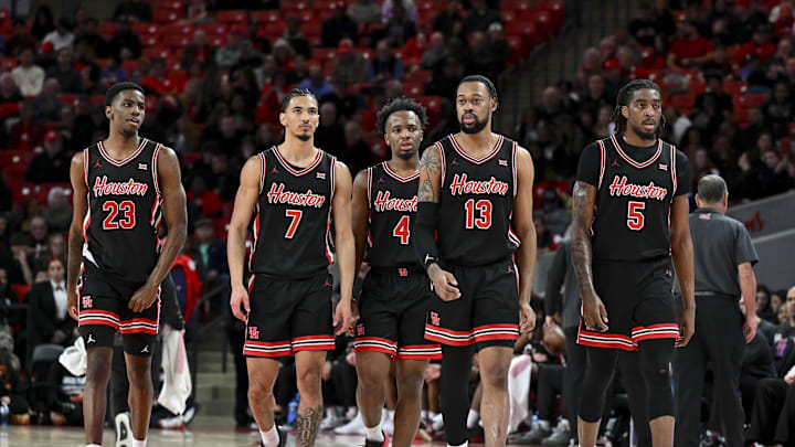 Jan 22, 2025; Houston, Texas, USA; Houston Cougars guard Terrance Arceneaux (23), guard Milos Uzan (7), guard L.J. Cryer (4), forward J'Wan Roberts (13) and forward Ja'Vier Francis (5) walk on the court after a time-out in the second half against the Utah Utes at Fertitta Center. The Cougars defeated the Utes 70-36. Mandatory Credit: Maria Lysaker-Imagn Images 