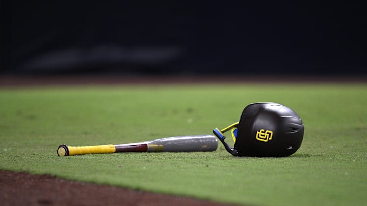 Aug 22, 2023; San Diego, California, USA; A detailed view of a San Diego Padres helmet and bat in the field during the seventh inning against the Miami Marlins at Petco Park. 