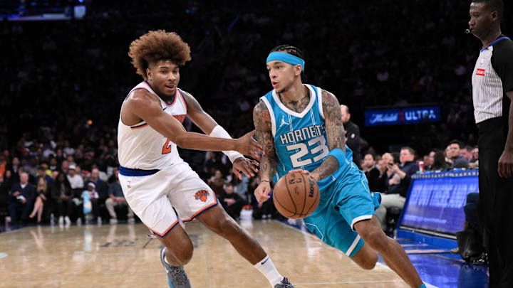 Oct 15, 2024; New York, New York, USA; Charlotte Hornets guard Tre Mann (23) drives to the basket while being defended by New York Knicks guard Miles McBride (2) during the second half at Madison Square Garden. Mandatory Credit: John Jones-Imagn Images Oct 15, 2024; New York, New York, USA; Charlotte Hornets guard Tre Mann (23) drives to the basket while being defended by New York Knicks guard Miles McBride (2) during the second half at Madison Square Garden. Mandatory Credit: John Jones-Imagn Images