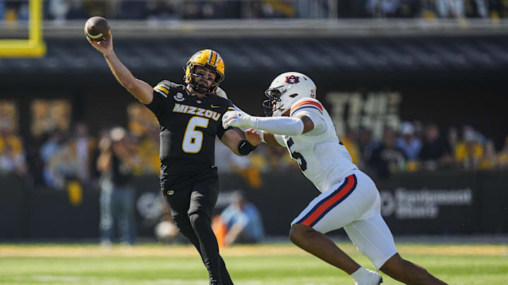 Oct 19, 2024; Columbia, Missouri, USA; Missouri Tigers quarterback Drew Pyne (6) throws a pass against Auburn Tigers defensive lineman Keldric Faulk (15) during the first half at Faurot Field at Memorial Stadium. Mandatory Credit: Jay Biggerstaff-Imagn Images Oct 19, 2024; Columbia, Missouri, USA; Missouri Tigers quarterback Drew Pyne (6) throws a pass against Auburn Tigers defensive lineman Keldric Faulk (15) during the first half at Faurot Field at Memorial Stadium. Mandatory Credit: Jay Biggerstaff-Imagn Images