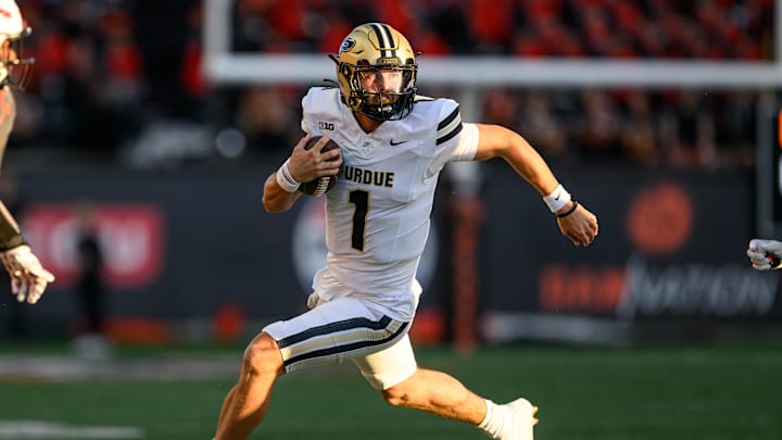 Purdue Boilermakers quarterback Hudson Card (1) runs the ball Purdue Boilermakers quarterback Hudson Card (1) runs the ball